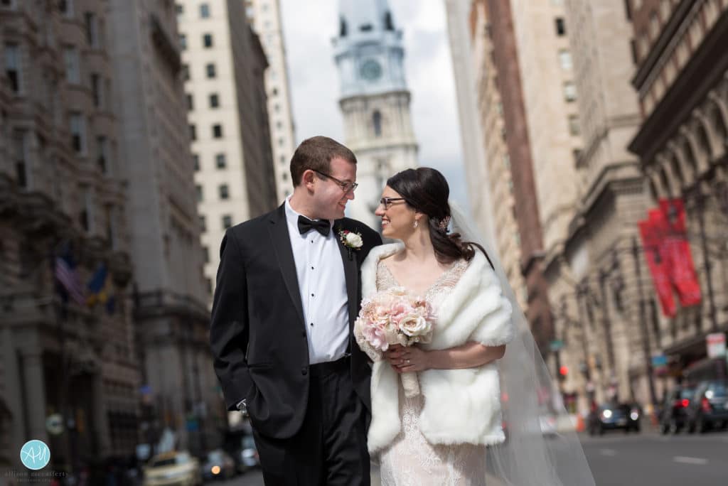 bride and groom on broad street in front of city hall