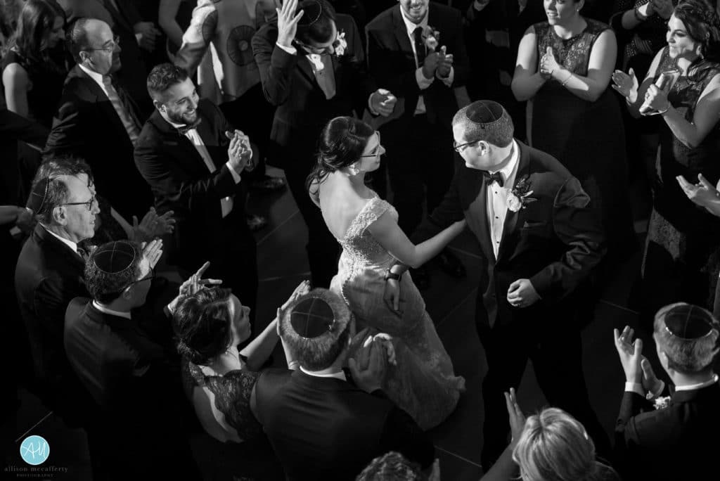 bride and groom dance to the hora