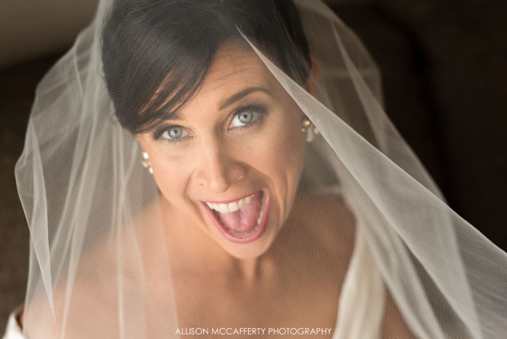 Excited bride under veil