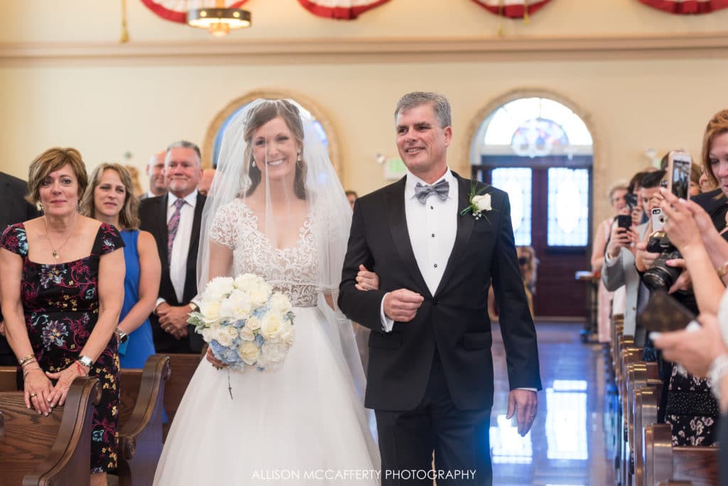 Dad walking daughter down the aisle