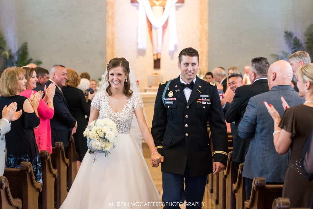 Husband and wife walking out of the church