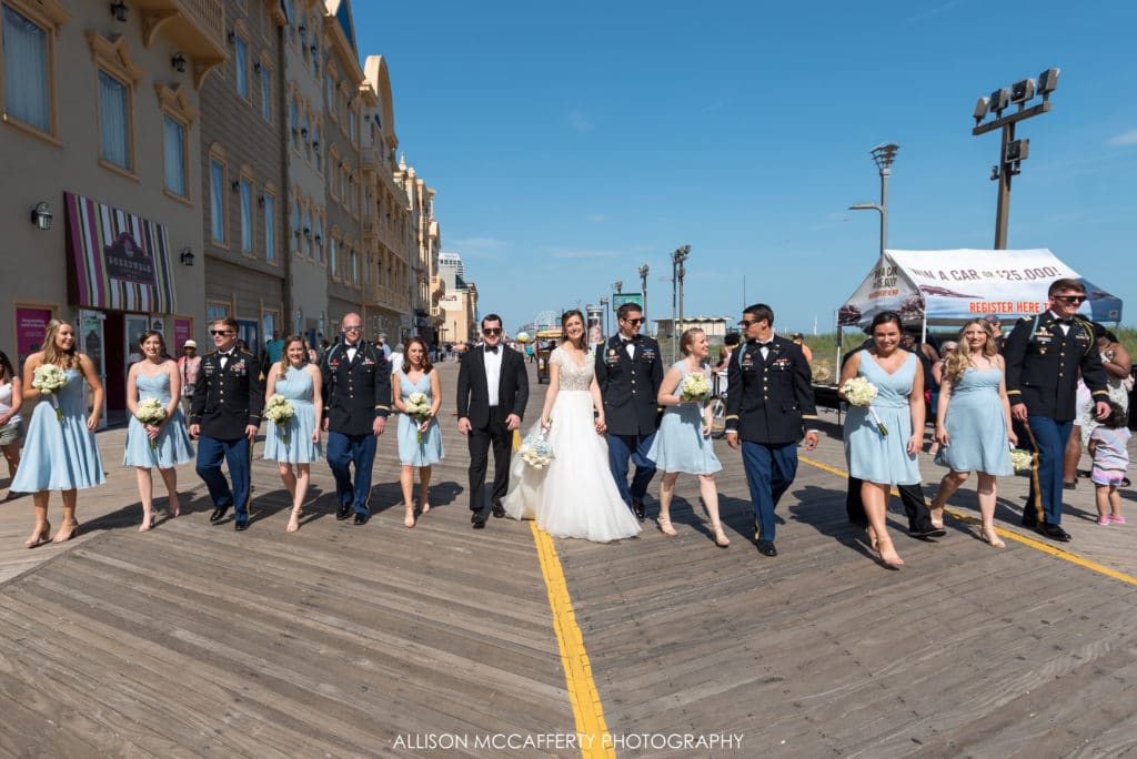 Bridal party walking down the boardwalk in Atlantic City