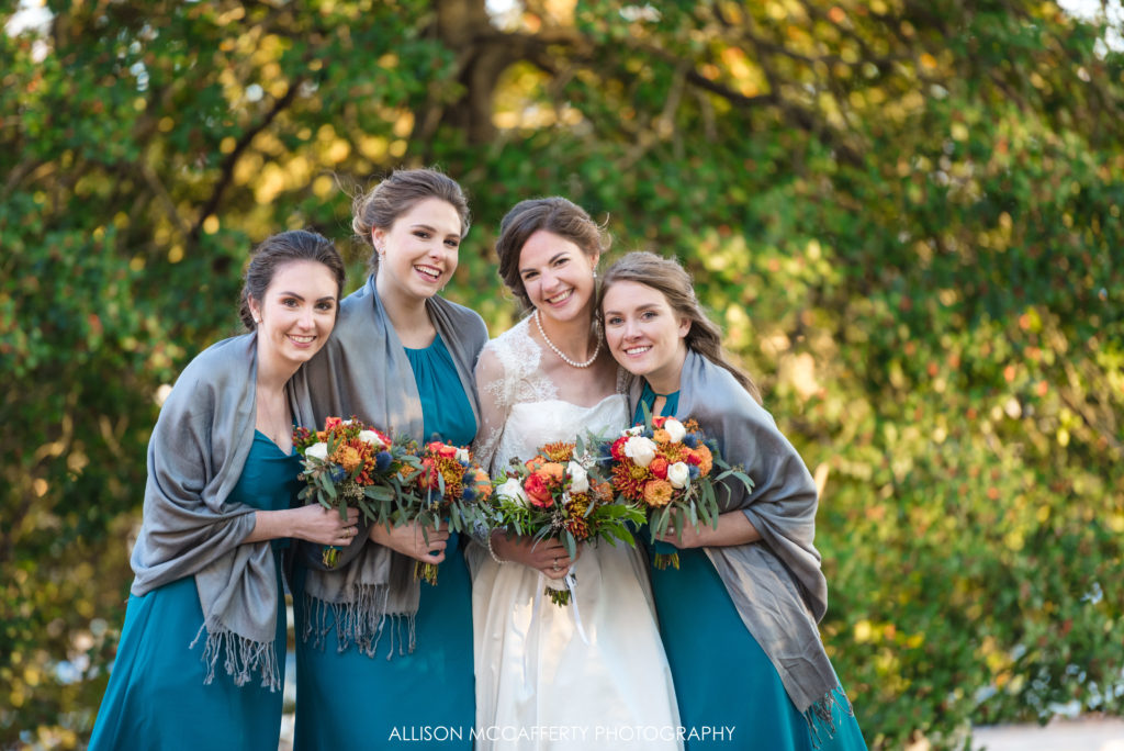 Bride and her maids in teal dresses