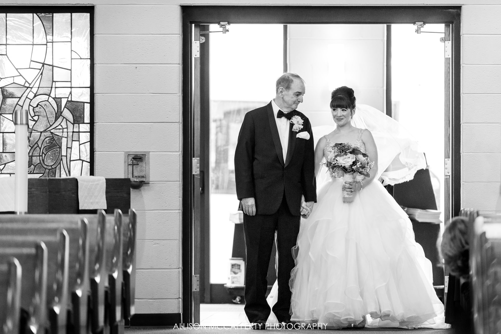 Black and White photo of the bride and her dad getting ready to walk down the aisle