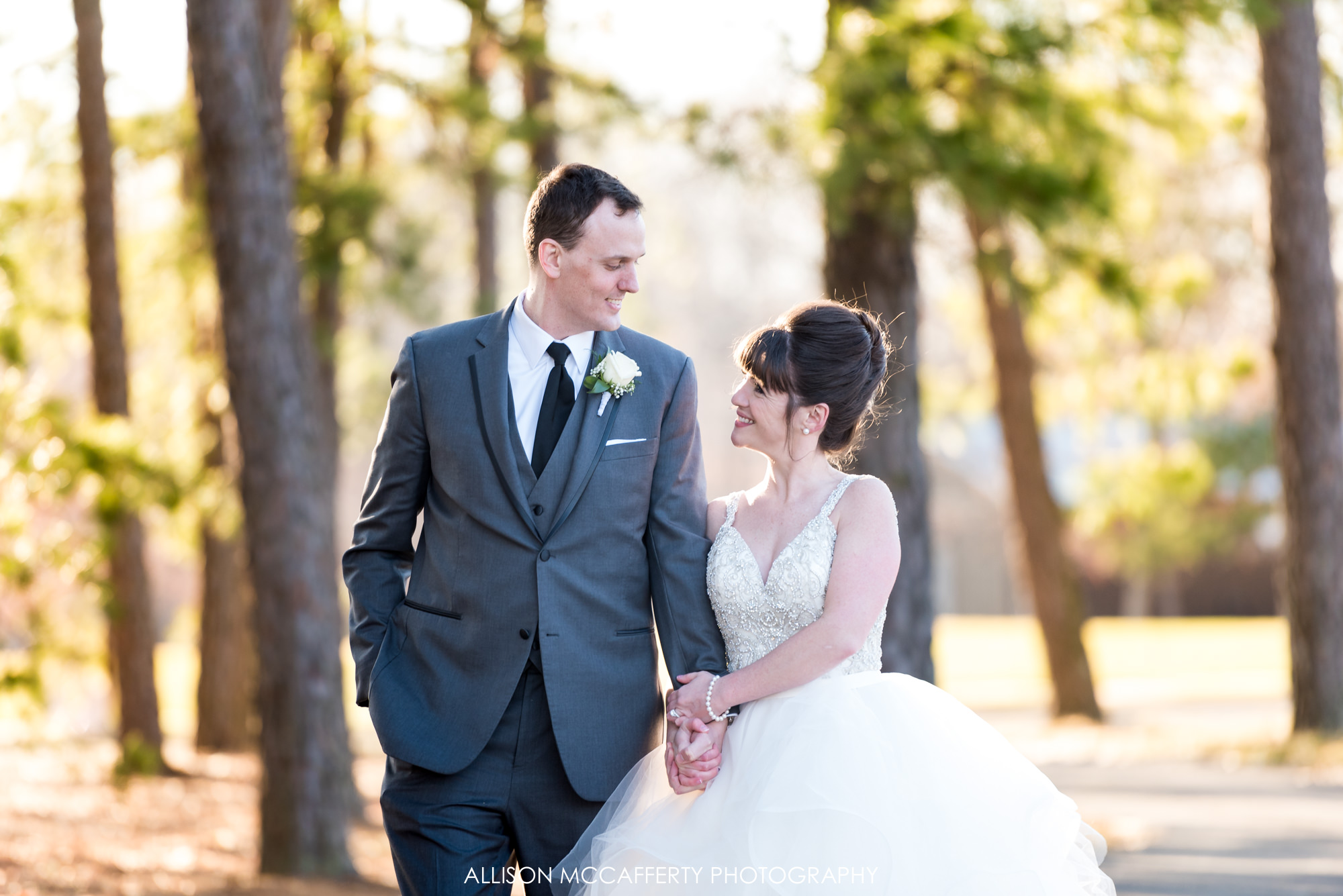 Bride and Groom outside by pine trees