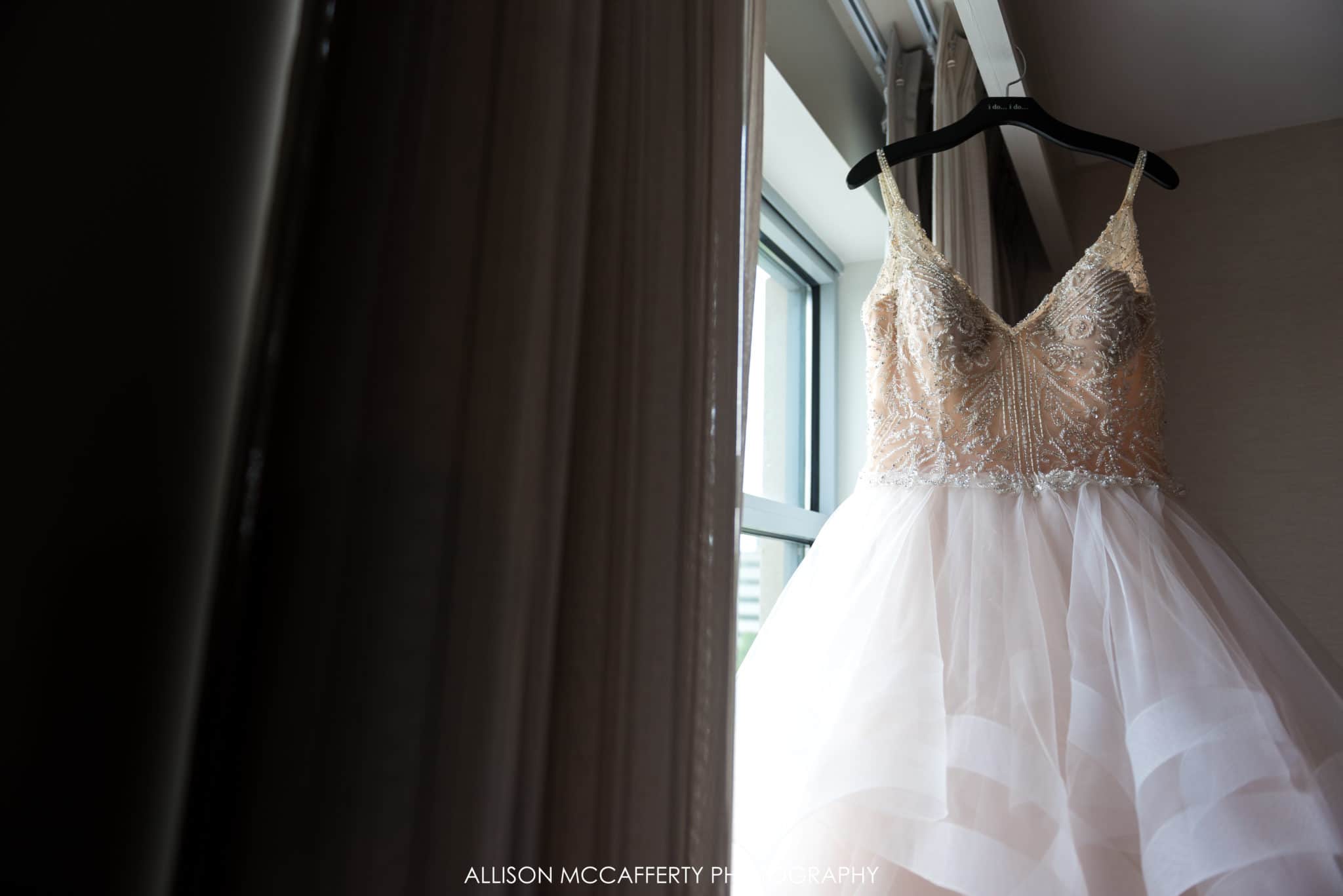Wedding gown hanging in the window