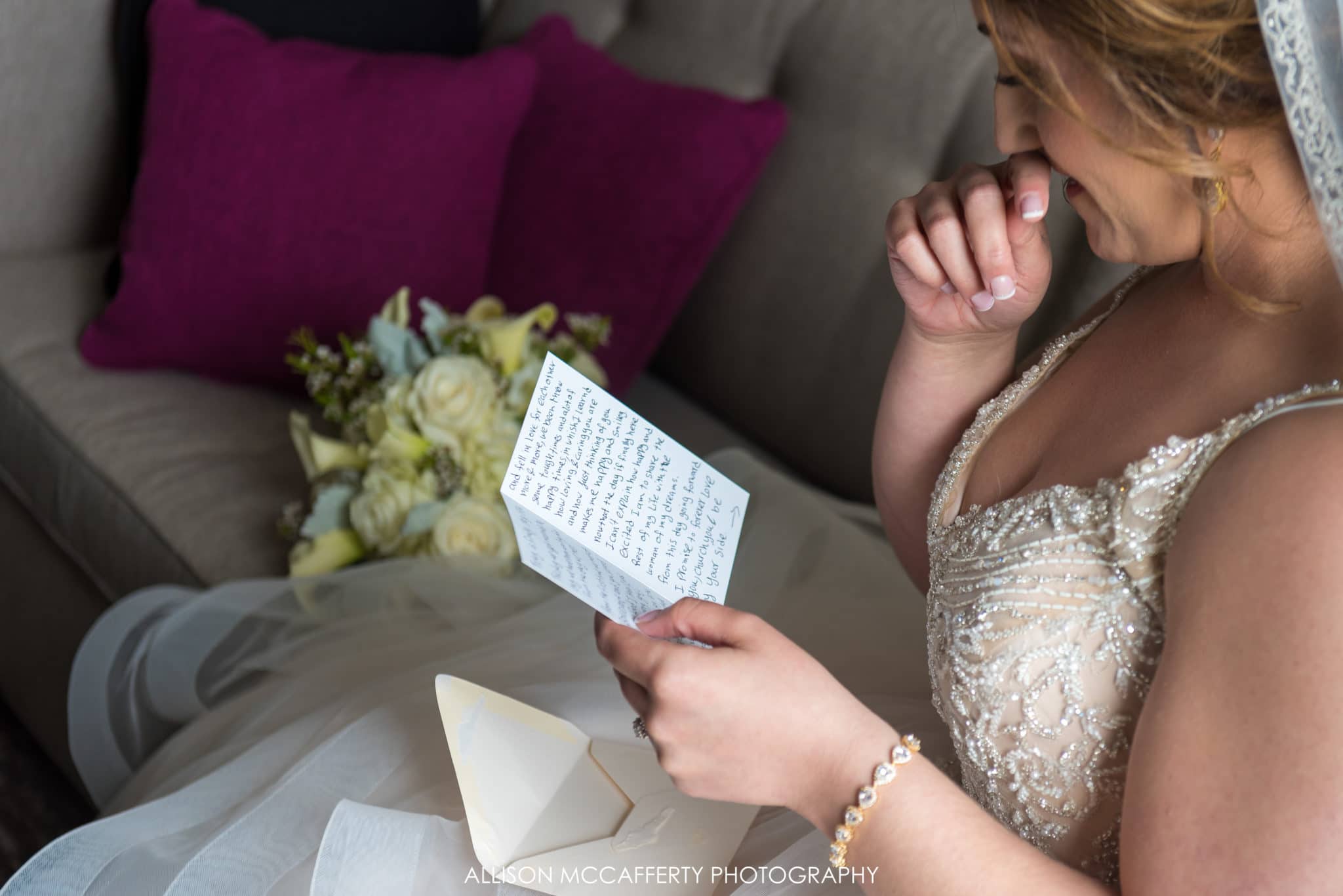 bride reading card from her groom