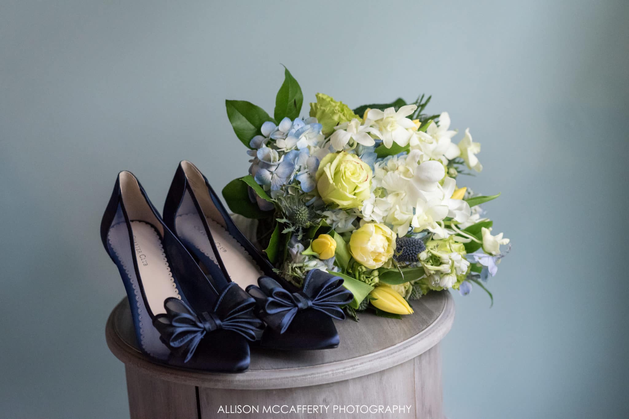 Blue wedding shoes and bouquet
