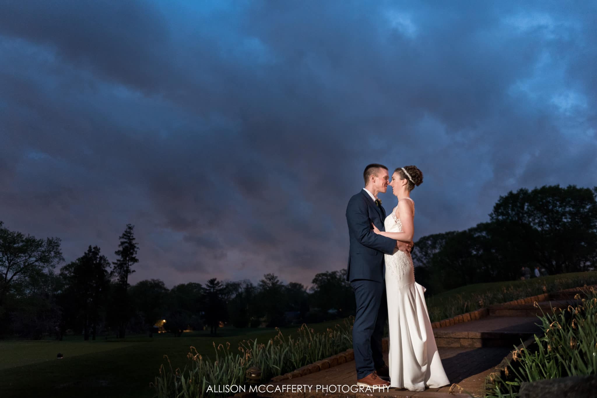 Portrait of bride and groom after the rain behind Tavistock Country Club