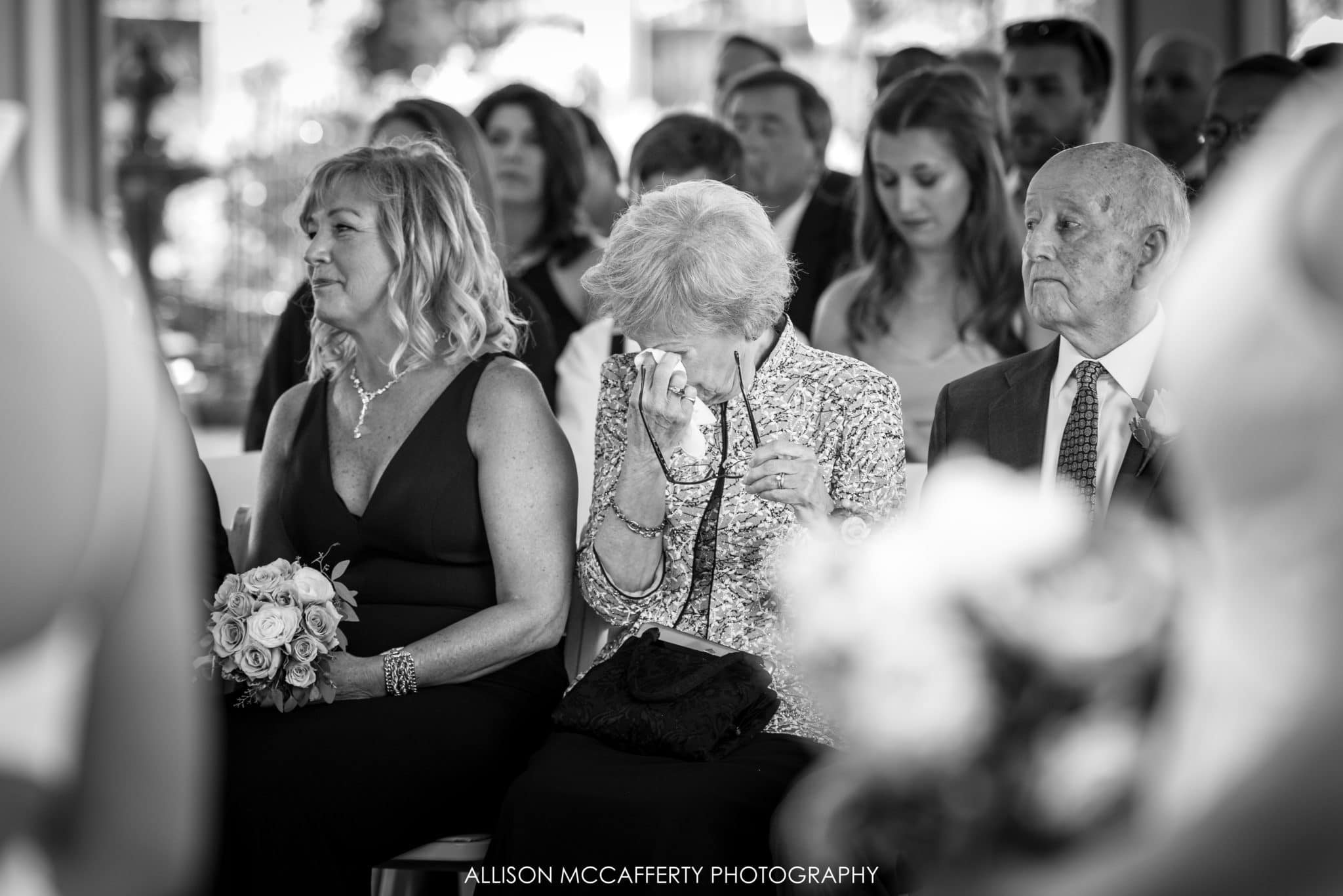 Grandmother crying during wedding ceremony