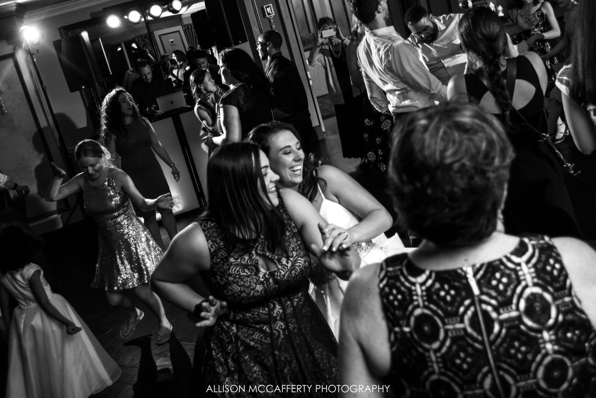 black and white photo of wedding reception dancing