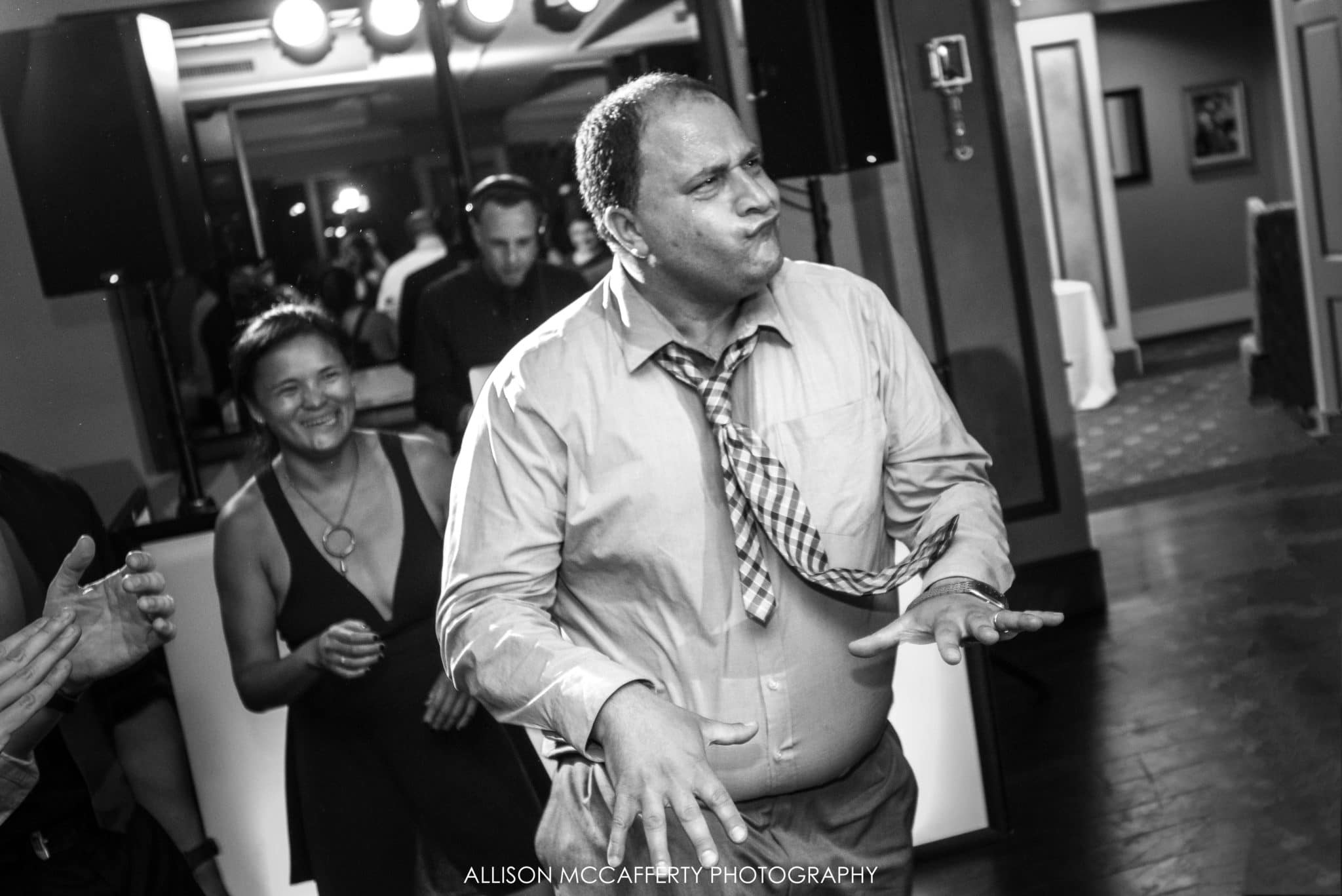 black and white dancing photo at a wedding