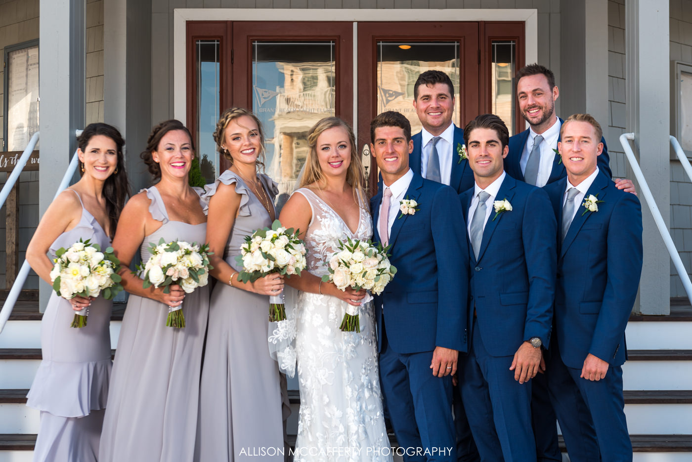 Bridal party photo in front of Brant Beach Yacht Club