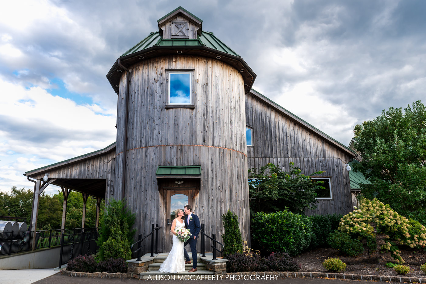 Wedding portrait in front of the silo at Rose Bank Winery