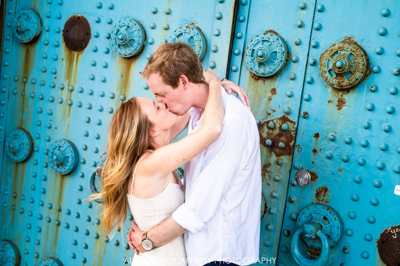 Engagement Photo in front of blue doors in Philadelphia
