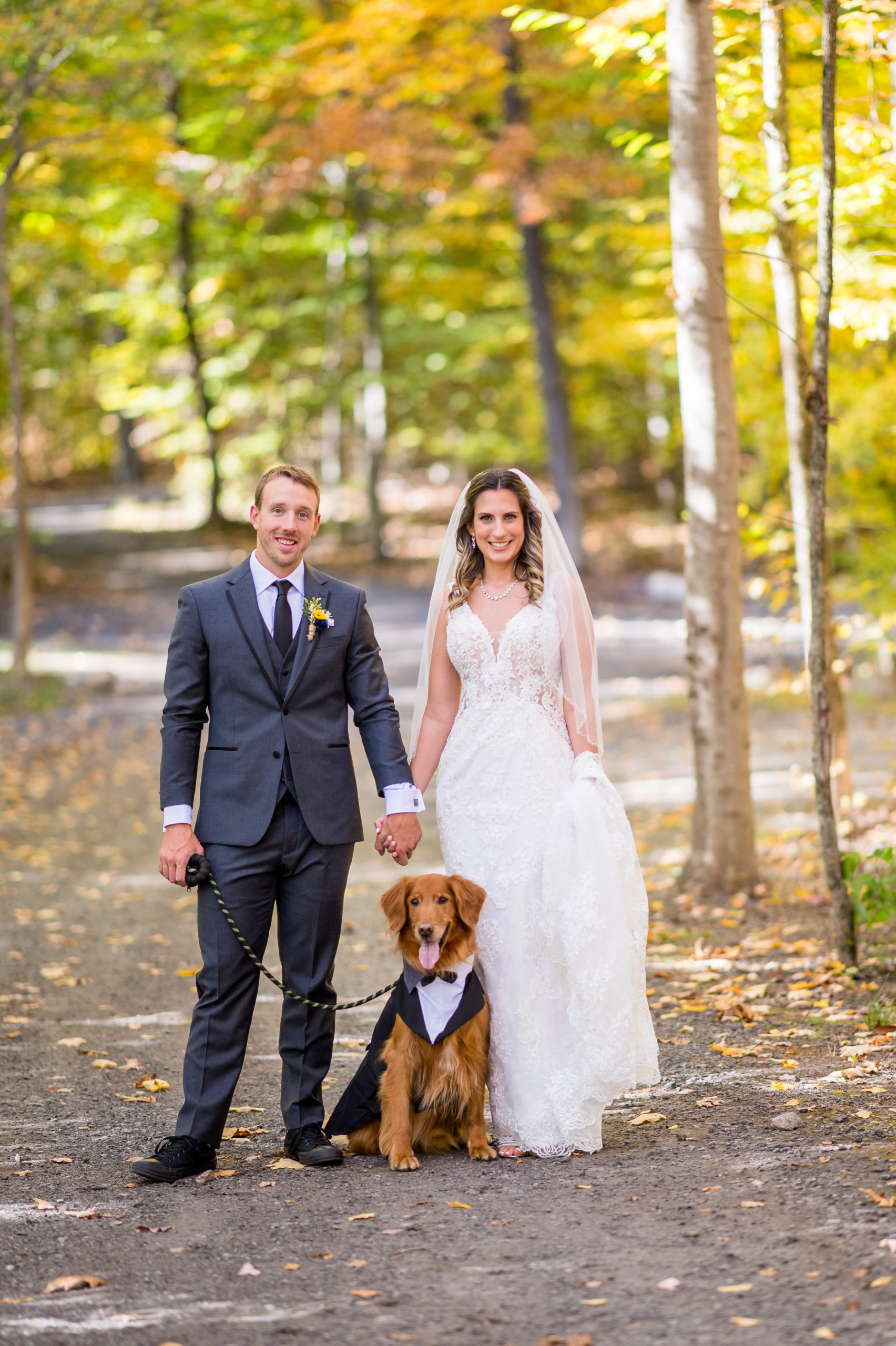 Wedding photo of a couple and their dog in the woods at Triplebrook Campground in Blairstown NJ