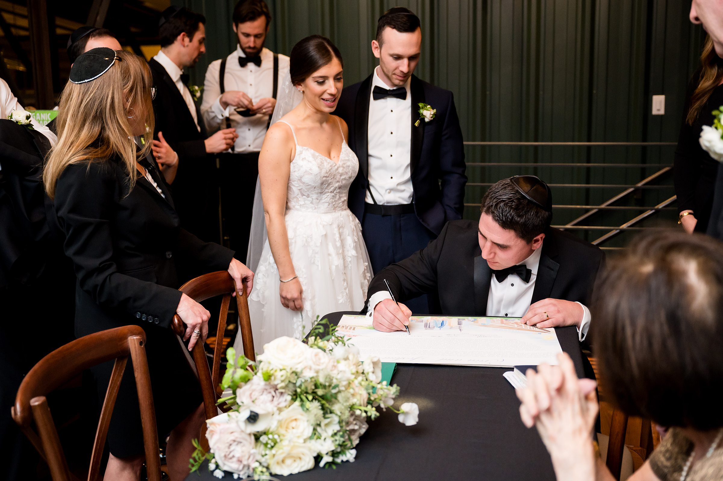 At a Lilah Events wedding, the bride and groom sign their wedding vows.