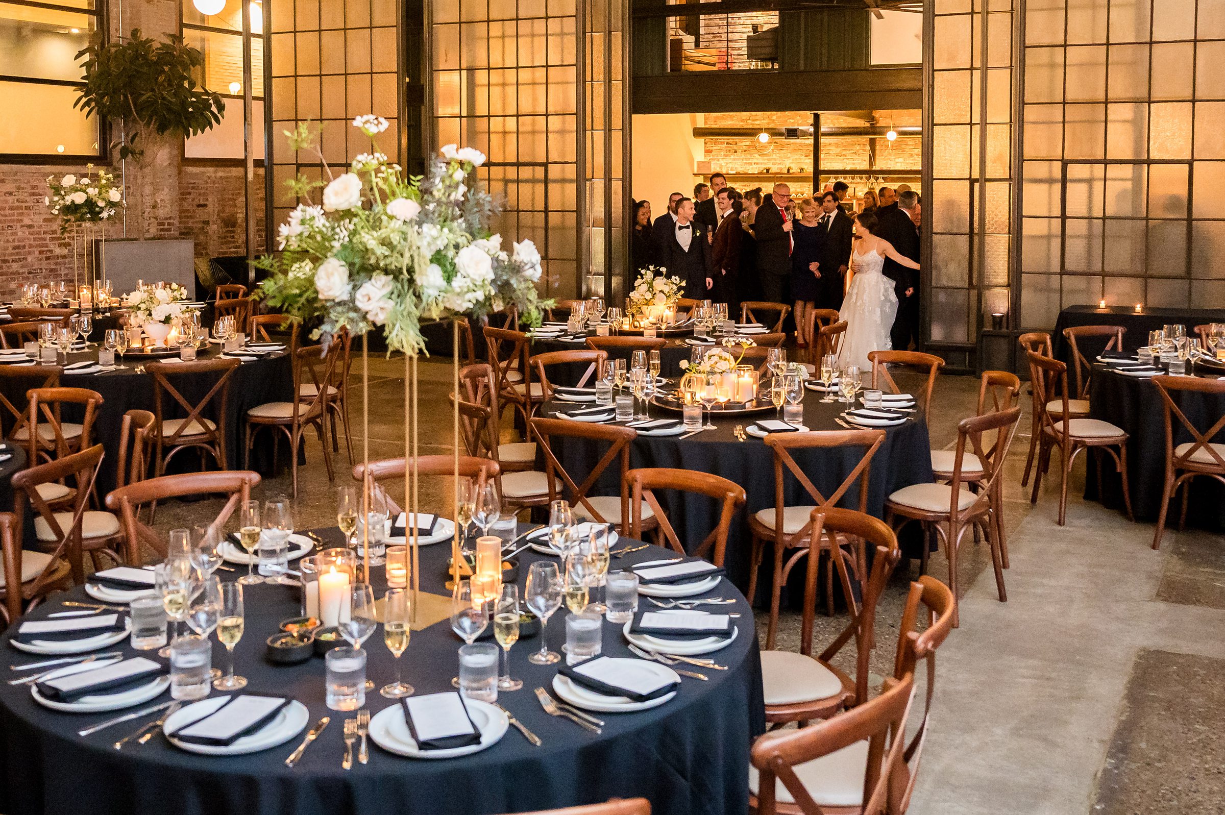 A black and white wedding reception in a warehouse, designed by Lilah Events.