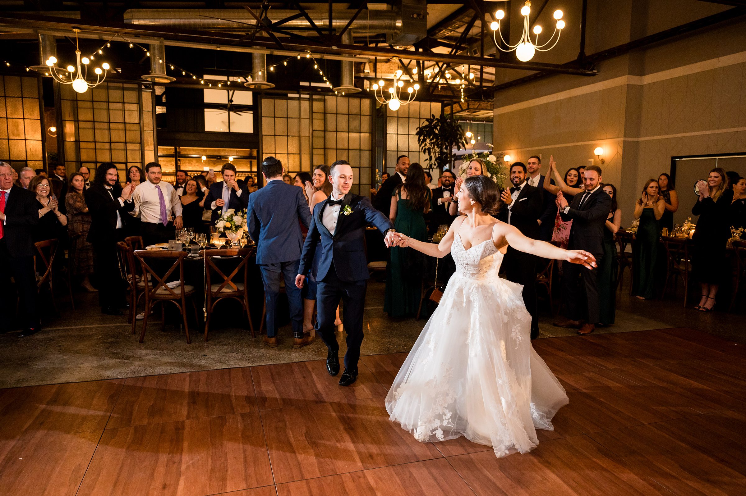A bride and groom dancing on the dance floor at their Lilah Events wedding reception.