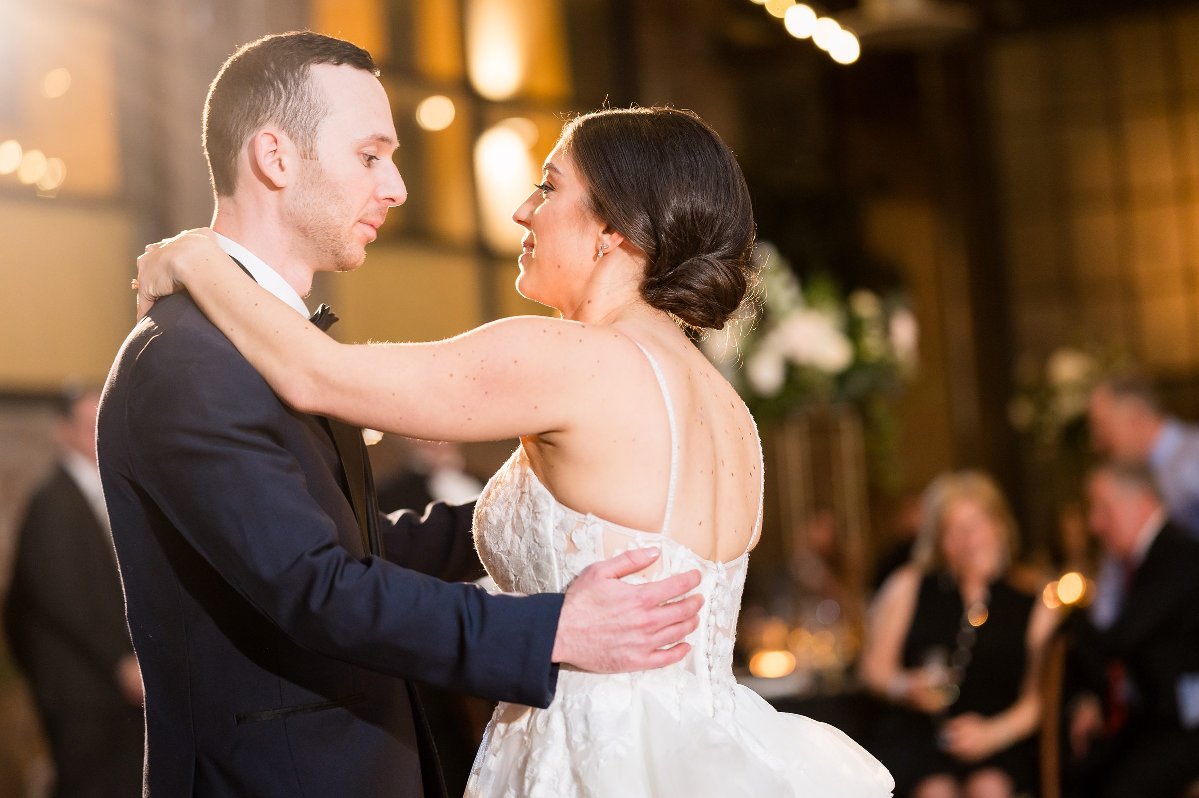 At a Lilah Events wedding, the bride and groom gracefully share their first dance at the reception.