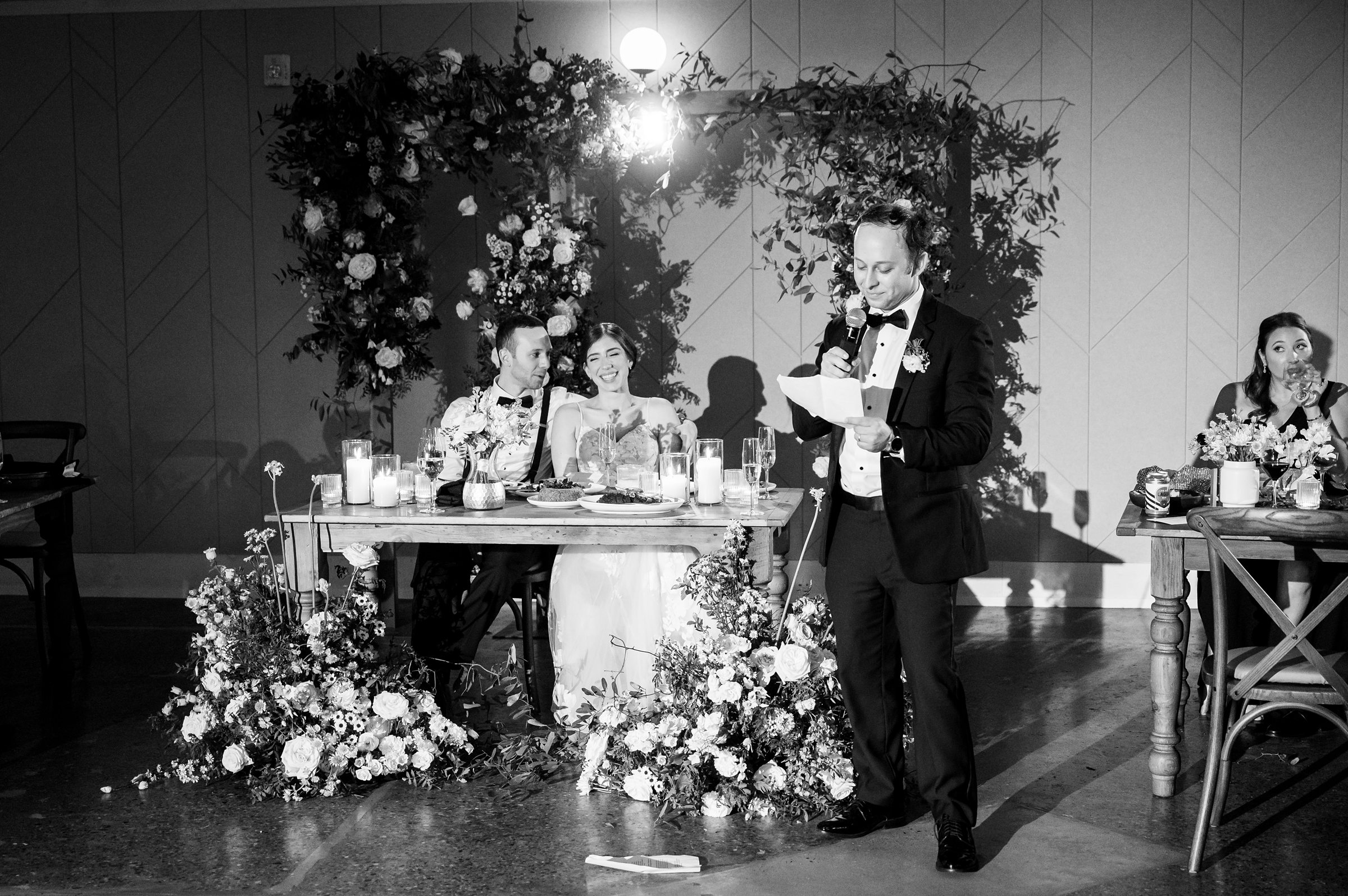 A bride and groom giving a toast at their Lilah Events wedding reception.