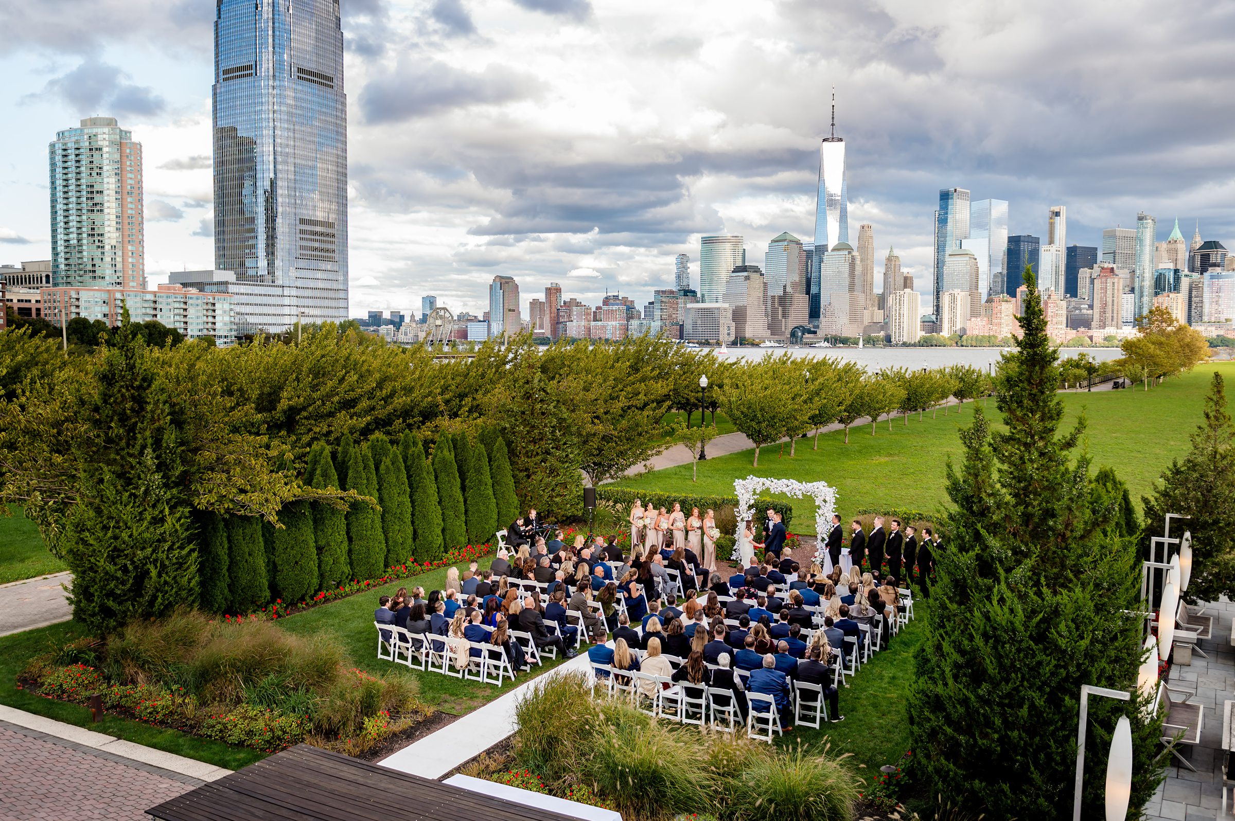 An outdoor wedding with a view of the manhattan skyline at Liberty House.