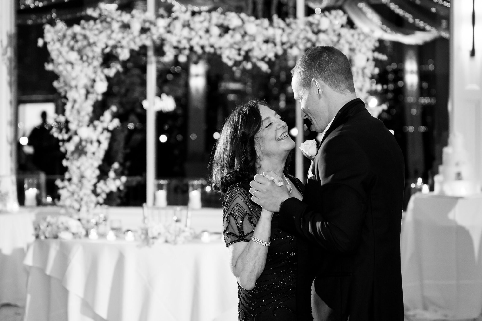 A mother and son sharing a first dance at a wedding.