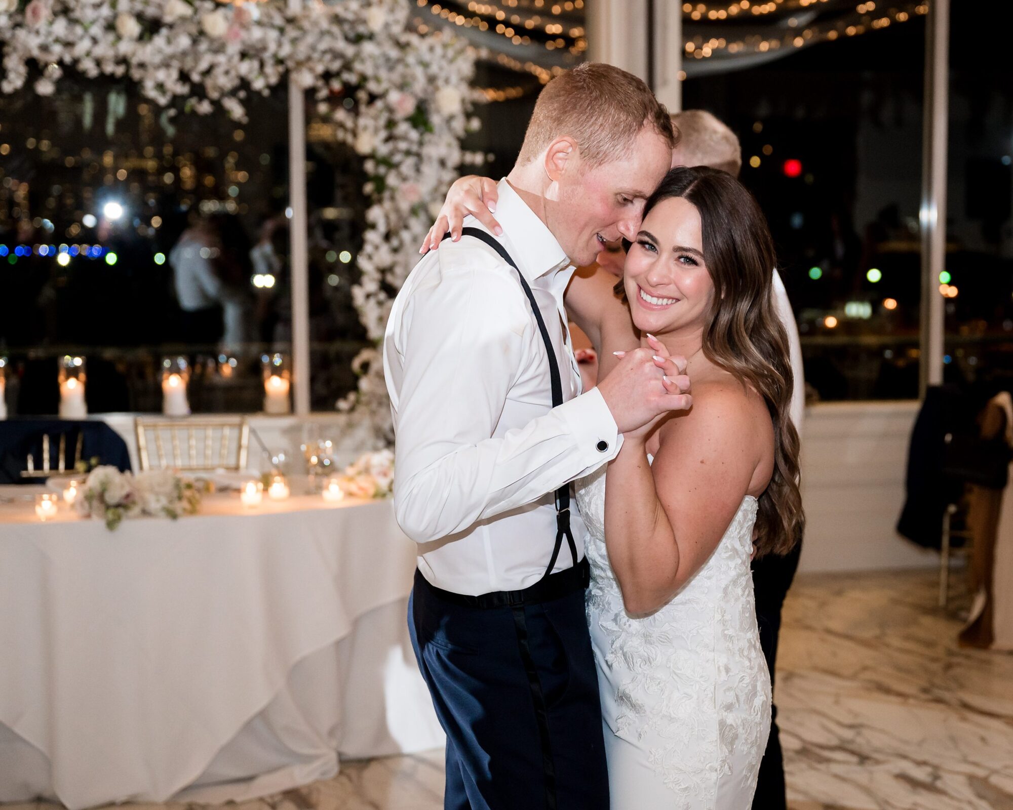 A bride and groom sharing their first dance at their wedding reception.