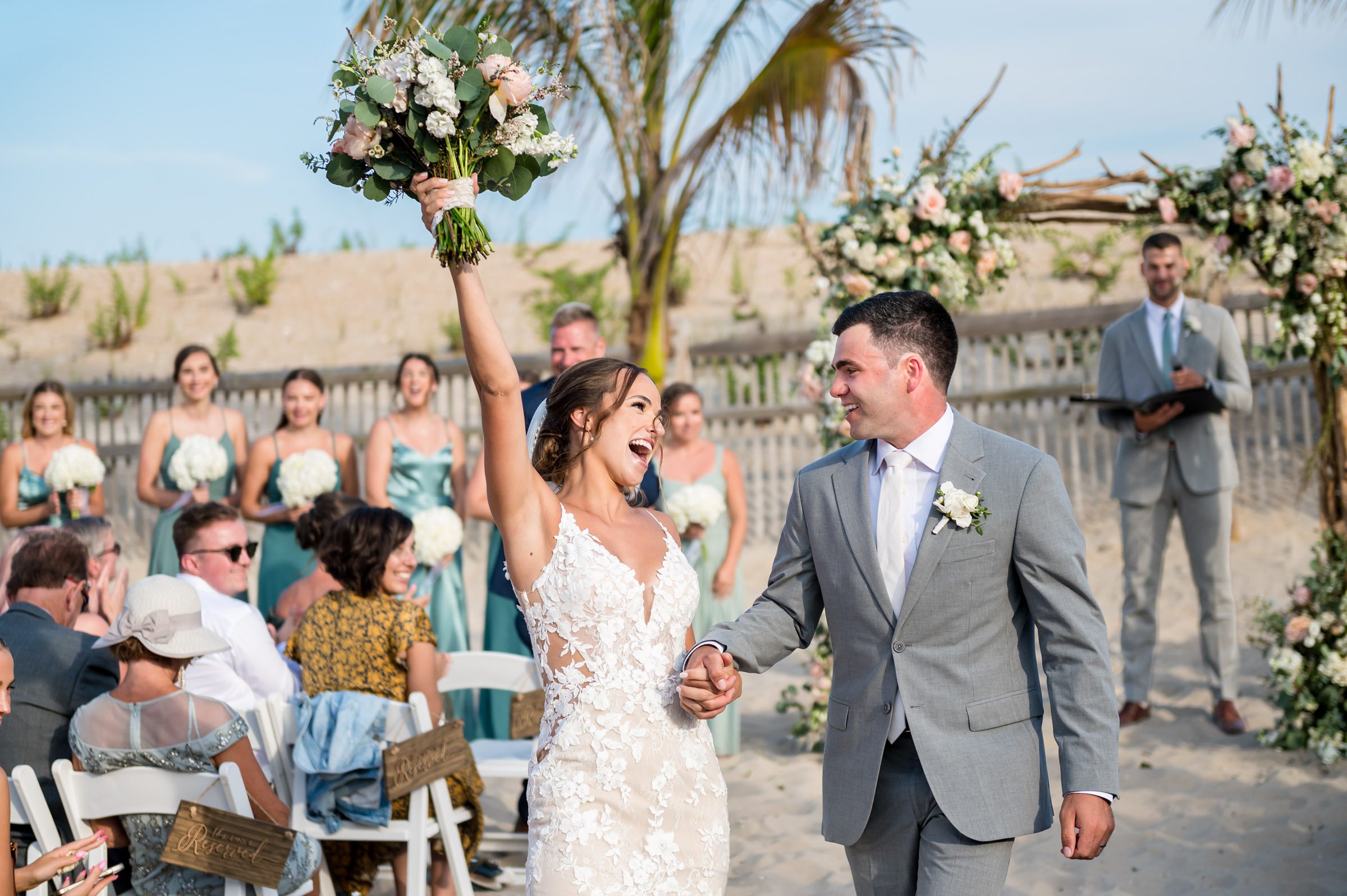 Bride and groom after their wedding ceremony on the beach at the Sea Shell Resort in Beach Haven, NJ.