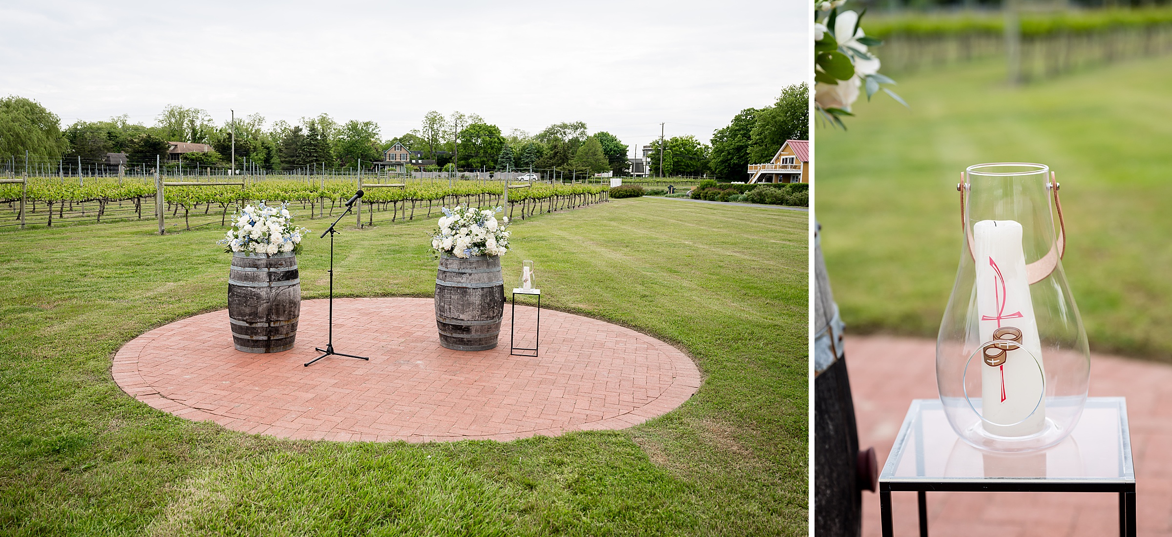 An outdoor wedding setup with two wooden barrels topped with white flower arrangements and a microphone stand on a brick platform, placed on a lawn. A close-up shows a glass vase holding a candle and ribbon.