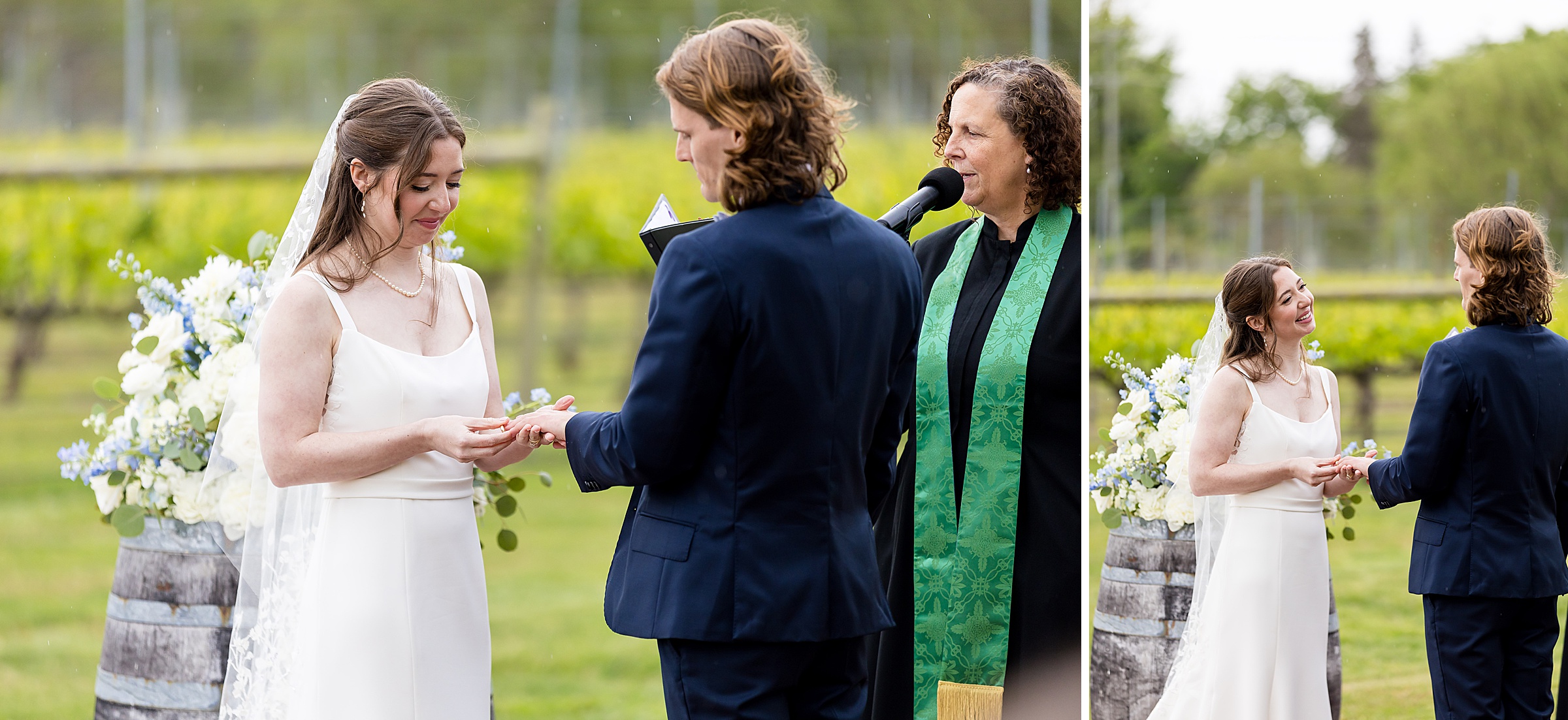 A bride and groom exchange rings during an outdoor wedding ceremony with an officiant standing beside them. The bride and groom smile at each other in front of greenery and floral arrangements.